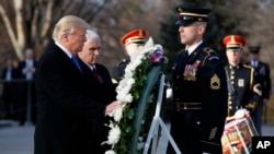 President-elect Donald Trump, accompanied by Vice President-elect Mike Pence places a wreath at the Tomb of the Unknowns, Jan. 19, 2017, at Arlington National Cemetery in Arlington, Virginia.