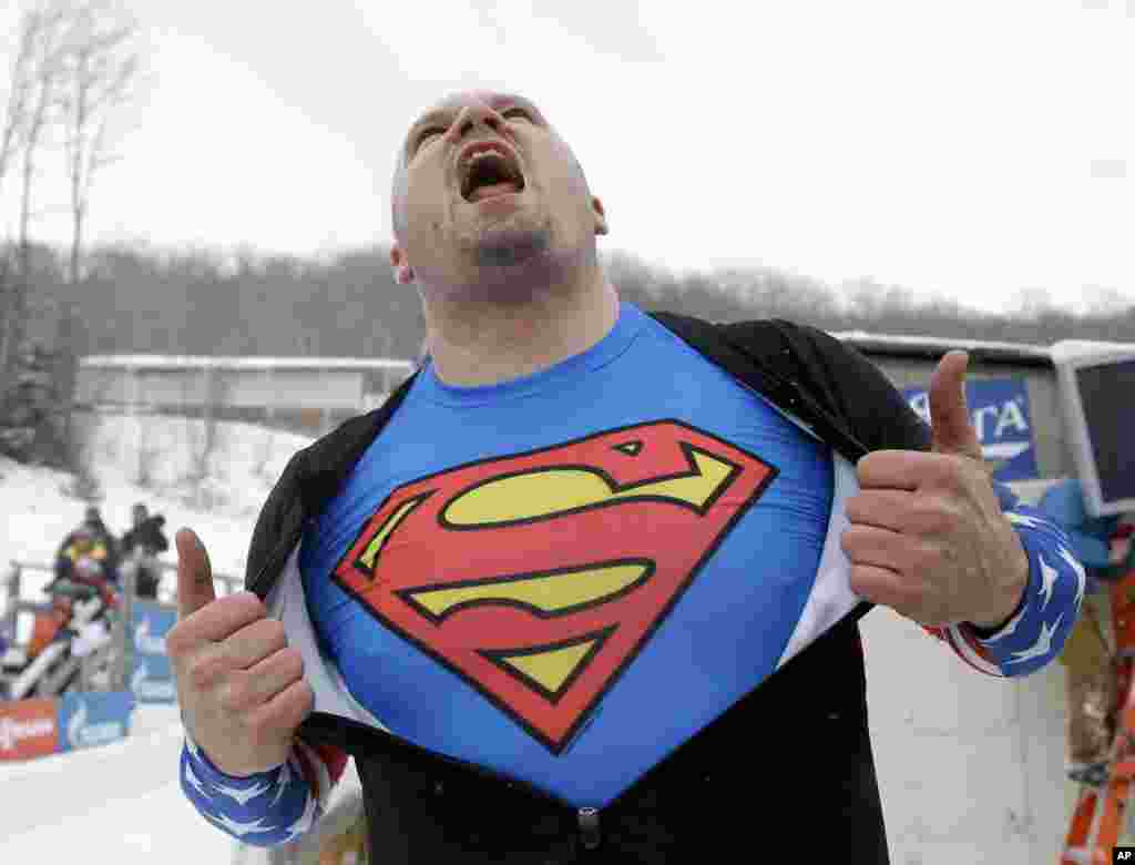 United States' Steven Holcomb celebrates after driving to a win with brakeman Steven Langton in the two-man bobsled World Cup event in Lake Placid, New York.