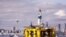 FILE - The oil drilling rig Polar Pioneer is towed toward a dock and in view of the Space Needle in Elliott Bay in Seattle, May 14, 2015. Researchers say the hammering of oil drills creates noise pollution that harms sea life.