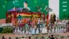 Pakistanis sing songs and wave national flags during a flag rising ceremony to mark the country's 67th Independence Day in Islamabad August 14, 2013. Pakistan gained independence from British rule in 1947. REUTERS/Mian Khursheed (PAKISTAN - Tags: POLITIC