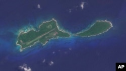 This image provided by Planet Labs PBC shows Islas del Cisne in Honduras, on July 13, 2023. Honduras says it will build a maximum security prison on this tiny island off its Caribbean coast to contain the country's most dangerous criminals.(Planet Labs PBC via AP)
