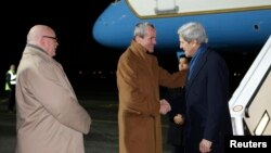 U.S. Secretary of State John Kerry (R) is greeted by U.S. Ambassador to Germany Philip Murphy (C) on arrival at Tegel International Airport in Berlin, February 25, 2013