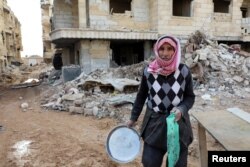 A survivor of an earthquake in the rebel-held town of Jandaris, Syria, February 11, 2023. REUTERS/Mahmoud Hassano