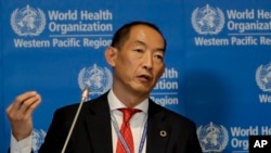 FILE – World Health Organization Regional Director for Western Pacific Takeshi Kasai addresses the media at the start of the five-day annual session, Oct. 7, 2019, in Manila, Philippines. 