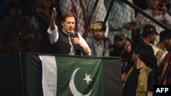 FILE - Pakistan's former Prime Minister and Pakistan Tehreek-e-Insaf party (PTI) chief Imran Khan, delivers a speech to his supporters during a rally celebrate the 75th anniversary of Pakistan's independence day in Lahore, Aug. 13, 2022. 