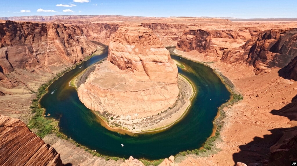 FILE - The Colorado River flows at Horseshoe Bend in the Glen Canyon National Recreation Area, in Page, Arizona, June 8, 2022. (AP Photo/Brittany Peterson, File)