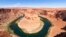 FILE - The Colorado River flows at Horseshoe Bend in the Glen Canyon National Recreation Area, in Page, Arizona, June 8, 2022.