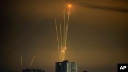 Russian rockets launch against Ukraine from Russia's Belgorod region are seen at dawn in Kharkiv, Ukraine, Aug. 20, 2022.