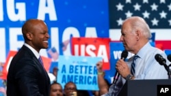 US President Joe Biden greets Maryland Democratic gubernatorial candidate Wes Moore during a rally for the Democratic National Committee at Richard Montgomery High School, Aug. 25, 2022, in Rockville, Md.
