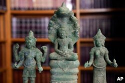 Some of the Cambodian antiquities recovered by the United States Attorney's Office are displayed during a news conference in New York, Monday, Aug. 8, 2022.