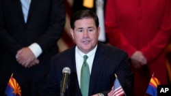 FILE - Arizona Republican Gov. Doug Ducey speaks during a bill signing in Phoenix, Arizona, Apr. 15, 2021,. Ducey has arrived in Taiwan on Tuesday for a visit focused on semiconductors. 