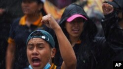 A demonstrator takes part in a march seeking justice for the missing 43 Ayotzinapa students in Mexico City, Aug. 26, 2022.