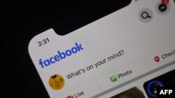 In this photo illustration a Facebook feed page is displayed on a smartphone on March 25, 2020 in Arlington, Virginia. Facebook use by U.S. teens has plummeted, according to data from the Pew Research Center.