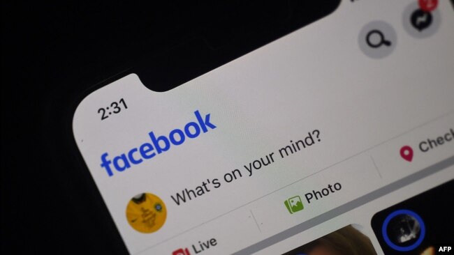 In this photo illustration a Facebook feed page is displayed on a smartphone on March 25, 2020 in Arlington, Virginia. Facebook use by U.S. teens has plummeted, according to data from the Pew Research Center.
