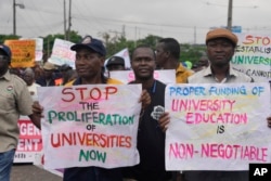 FILE - Nigeria Labour union protest in solidarity with the Academic Staff Union of Universities, on the street in Lagos, Nigeria, on July 26, 2022.