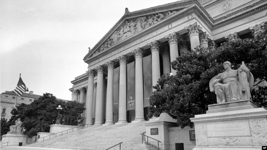 FILE - The National Archives Building in Washington, D.C., is shown on Aug. 7, 1984. The banner hanging from the columns reads, 'The Archives at 50.' 