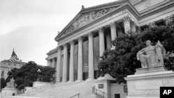 FILE - The National Archives Building in Washington, D.C., is shown on Aug. 7, 1984. The banner hanging from the columns reads, 'The Archives at 50.' 