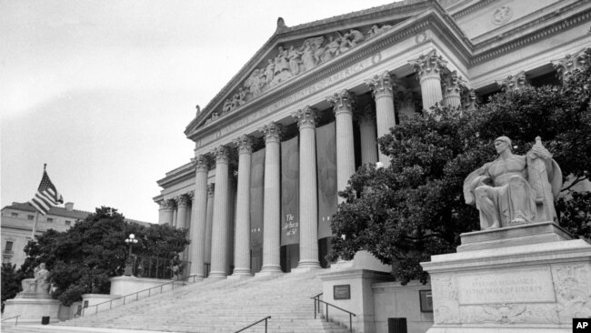 FILE - The National Archives Building in Washington, D.C., is shown on Aug. 7, 1984. The banner hanging from the columns reads, 'The Archives at 50.'