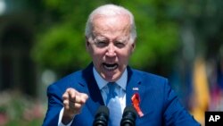 FILE - President Joe Biden speaks during an event to celebrate the passage of the "Bipartisan Safer Communities Act," a law meant to reduce gun violence, on the South Lawn of the White House, July 11, 2022.