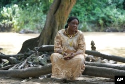 Priestess Yeyerisa Abimbola speaks during an interview at the sacred Osun River in Osogbo, Nigeria, on May 29, 2022.