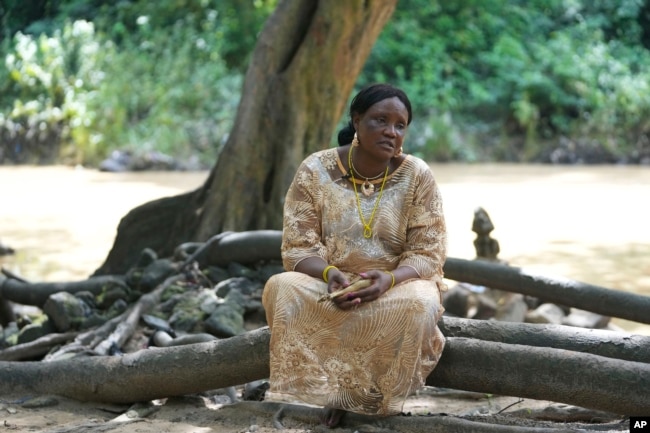 Priestess Yeyerisa Abimbola speaks during an interview at the sacred Osun River in Osogbo, Nigeria, on May 29, 2022.