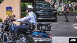 Secret Service and local law enforcement officers are seen in front of the home of former President Donald Trump at Mar-a-Lago in Palm Beach, Florida, on Aug. 9, 2022. 