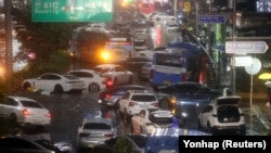 Abandoned vehicles fill the road in flooded area during heavy rain in Seoul, South Korea, on August 8, 2022.