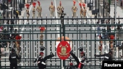 Pakistan Rangers (wearing black uniforms) perform during a parade on the Pakistan's 72nd Independence Day at the Pakistan-India joint check post at Wagah border, near Lahore, Pakistan, Aug. 14, 2019. 