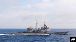 FILE - The guided-missile cruiser USS 'Chancellorsville' transits the Philippine Sea, June 18, 2016. (Mass Communication Specialist 2nd Class Ryan J. Batchelder/U.S. Navy via AP)