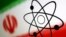 FILE - The atomic symbol and the Iranian flag are seen in this illustration, July 21, 2022.