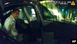 FILE - This Aug. 8, 2020, still image taken from officer video provided by the Albuquerque Police Department shows the arrest of Muhammad Syed.