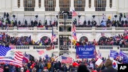 FILE - Insurrectionists loyal to President Donald Trump breach the Capitol in Washington, Jan. 6, 2021. 