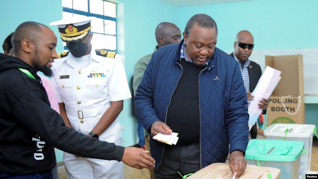 Kenya's President Uhuru Kenyatta casts his ballot at Mutomo primary school polling station in Gatundu area of Kiambu, Kenya, Aug. 9, 2022.