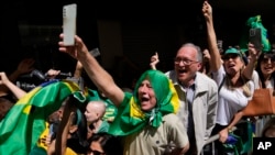 Supporters of Brazilian President Jair Bolsonaro attend his reelection campaign rally in Juiz de Fora, Minas Gerais state, Brazil, Aug. 16, 2022. 