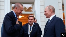 FILE: Russian President Vladimir Putin [right] and Turkish President Recep Tayyip Erdogan [left] thank each other after their talks at the Rus sanatorium in the Black Sea resort of Sochi, Russia. Taken 8.5.2022