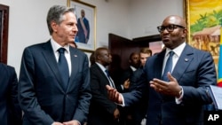 Democratic Republic of the Congo Prime Minister Jean-Michel Sama Lukonde, right, speaks as he meets with Secretary of State Antony Blinken, left, at the Primature in Kinshasa, Congo, Wednesday, Aug. 10, 2022. 
