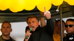 Brazilian President Jair Bolsonaro speaks to supporters at his re-election campaign rally in Juiz de Fora, Minas Gerais state, Brazil, Aug. 16, 2022.