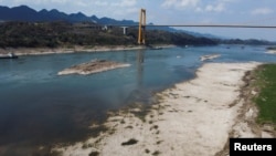 An aerial view shows the Yangtze river that is approaching record-low water levels during a regional drought in Chongqing, China, Aug. 20, 2022. 