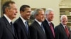 FILE - In this Jan. 7, 2009, photo, President George W. Bush, center, poses with President-elect Barack Obama, second left, and former presidents, George H.W. Bush, left, Bill Clinton, second right, and Jimmy Carter, right, in the Oval Office of the White