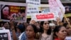 People condemning a recent government decision to free 11 convicts of a 2002 gang rape of a Muslim woman in Gujarat state from prison, gather for a protest in Mumbai, India, Aug. 23, 2022.