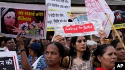 People condemning a recent government decision to free 11 convicts of a 2002 gang rape of a Muslim woman in Gujarat state from prison, gather for a protest in Mumbai, India, Aug. 23, 2022.