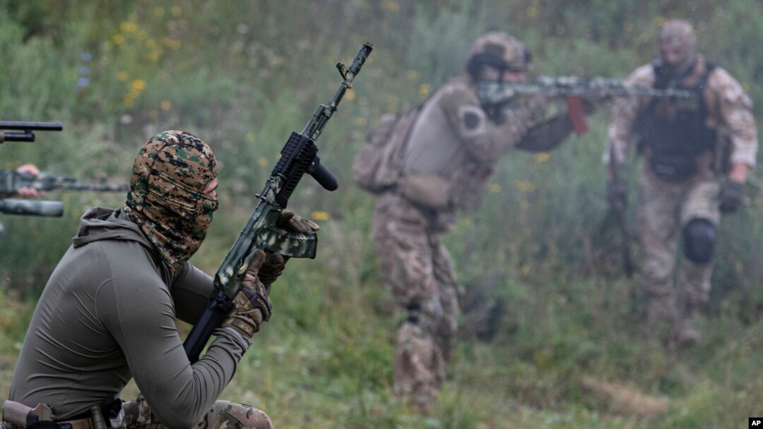 Volunteer soldiers attend training near Kyiv, Ukraine, Aug. 27, 2022. Fighters from Chechnya are participating on both sides of the conflict in Ukraine.