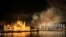 FILE - Fireworks explode over Danube River during Hungary's national holiday, St. Stephen's Day, in Budapest, Aug. 20, 2016. The 2022 fireworks were postponed because storms were forecast. 