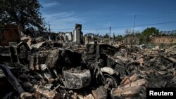 Residential houses destroyed by a Russian military strike are seen as Russia's attacks on Ukraine continue, in the town of Orikhiv, Zaporizhzhia region, Ukraine Aug. 27, 2022.