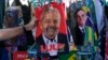 Brasil - eleiçōes 2022 - toalhas com a cara dos candidatos presidenciais Lula da Silva e Jair Bolsonaro