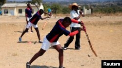 Kids practice cricket drills led by their female coach Hazvinei Kurisa at Munyawiri secondary school in rural Domboshava, Zimbabwe, August 20, 2022. REUTERS/Philimon Bulawayo 