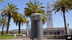 A made-to-order trash can called Salt and Pepper is seen near the Embarcadero and Ferry Building in San Francisco on July 26, 2022. Could it take years to make and cost more than $20,000? (AP Photo/Eric Risberg)