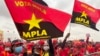 Apoiantes do MPLA exibem bandeiras do partido no comício de encerramento de campanha eleitoral. Camama, Luanda.