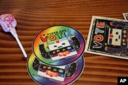 stickers put out for people during a mock election at Cafecito Bonito in in Anchorage, Alaska, where people ranked the performances by drag performers, July 28, 2022.
