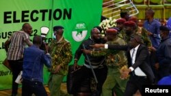 Members of opposition engage in a scuffle with the security officials as they block the IEBC chairman from making election result announcement at the IEBC National Tallying Centre at the Bomas of Kenya, in Nairobi, Kenya, Aug.15, 2022.